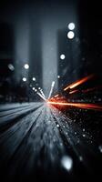 Nighttime city streets illuminated by light trails from passing vehicles during a snowstorm photo