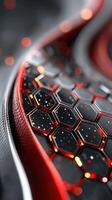 Close-up of a textured hexagonal pattern in striking red and black colors with a glossy finish highlighting intricate design photo