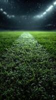 Rain-soaked soccer field illuminated by stadium lights at night creating a dramatic atmosphere for a match photo
