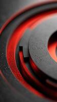 Abstract close-up of circular metallic shapes with red accents and water droplets on a black surface photo