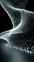 Dynamic flow of illuminated particles creates a mesmerizing visual effect in a dark environment photo
