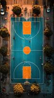 Basketball players engage in a lively game on a vibrant court during sunset in an urban park setting photo