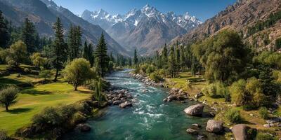 Stunning mountain landscape showcasing a clear river flowing through lush greenery in a picturesque valley photo
