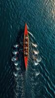 Rowers practice their skills on a tranquil lake in the early morning light with a vivid sky as backdrop photo
