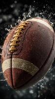 Football splashing in water capturing intense moment during outdoor play at sunset photo
