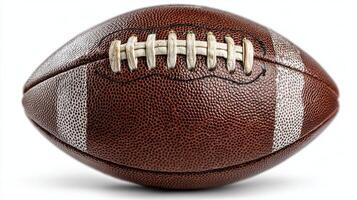 Brown leather football resting on a smooth surface with white stripes and laces for a sports-themed display photo