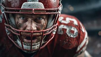 Intense football player focused on the game during a night match in the stadium photo