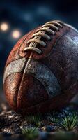 Vintage football resting on grass with a dramatic background during twilight photo