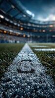 Spectacular view of a football field highlighting the goal line during a twilight matchup at a stadium photo
