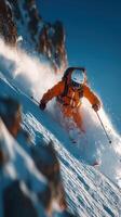 Skiing through fresh powder on a pristine slope in the mountains during a bright winter day photo