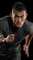 Intense runner sprinting in a dark studio setting during a high-energy workout session photo