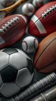 Various sports balls arranged on a dark surface showcasing diversity in athletics during a competitive season photo
