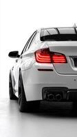 Sleek white car displayed in modern showroom highlighting design features and LED taillights photo