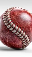 Detailed close-up of a worn baseball showcasing its textures and stitches against a neutral background photo