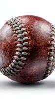 Vintage leather baseball resting on a flat surface with detailed stitching and wear marks visible photo