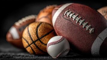 Various sports balls arranged in a creative display highlighting football, basketball, and baseball photo