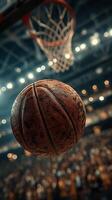 Basketball in mid-air with the hoop in the background during an exciting game photo