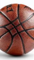 Basketball resting on white surface highlighting texture and details of design at indoor sports venue photo