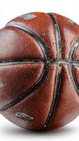 Basketball with worn texture resting on a white background, showcasing its unique details and craftsmanship photo