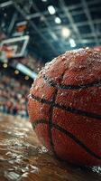 Basketball resting on a damp court after an intense game in an indoor arena filled with excited fans photo