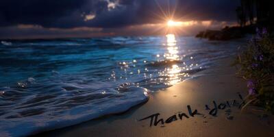Beautiful sunset over ocean waves with 'Thank you' written in the sand at a tranquil beach photo