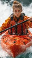 Kayaker navigating turbulent waters in a bright orange kayak while wearing a waterproof jacket during an adventure trip photo