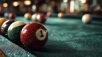 Pool balls scattered on a green felt table in a dimly lit bar during an evening game with friends photo