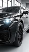 Sleek black luxury sedan showcasing its modern design and powerful presence in a well-lit urban setting photo