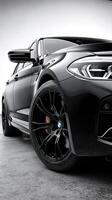 Luxury black car showcases sleek design and modern features in an upscale studio setting photo