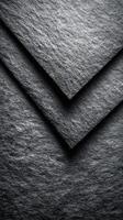 Textured black paper sheets arranged in layers highlighting intricate details of material quality photo