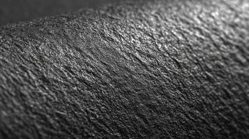 Surface texture of a rough material in black and white showcasing intricate details and patterns photo