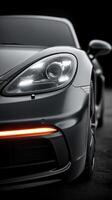 Sleek sports car showcased in dramatic lighting emphasizing design and performance features photo