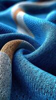 Textured blue fabric with intricate patterns and colors showcasing the beauty of textile design and craftsmanship photo
