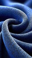 Blue fabric exhibiting a smooth swirl pattern with intricate textures and beautiful hues photo