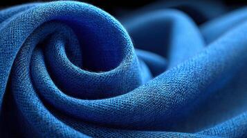 Vibrant blue fabric showcasing intricate texture and softness in close-up detail photo