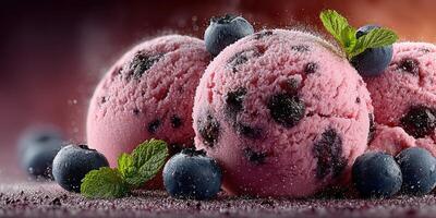 Delicious raspberry chocolate chip ice cream served with fresh blueberries and mint leaves photo