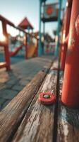 Vibrant playground close-up showing colorful equipment and wooden benches during golden hour photo