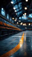 Empty seating area with glossy floor in a large sports arena during late evening hours photo