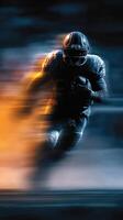 Dynamic football player sprinting with ball in intense motion during a night game photo