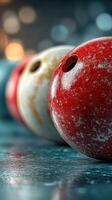 Vintage bowling balls arranged on a stylish surface with blurred lights in the background photo