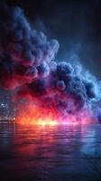 Colorful smoke and flames engulf urban landscape at night providing a striking visual spectacle photo