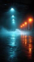 Mysterious ambiance in industrial warehouse illuminated by blue and orange lights with fog on the floor photo