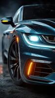 Sleek modern car glistening with rain droplets in a dramatic low-light urban setting at night photo