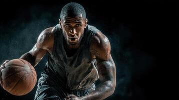 Intense basketball player dribbling during an energetic training session in a dimly lit gym photo
