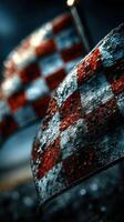 Colorful checkered flags flutter with droplets in the rain at a motorsport event in the evening light photo