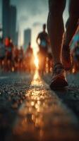 Runners participate in a city marathon as the sun sets behind skyscrapers in an urban setting photo