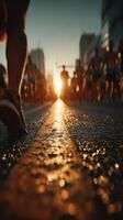 Urban marathon runners sprinting towards the sunset on a busy city street during an evening race photo