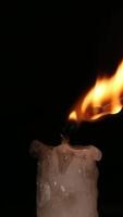 Candle Lighting Process and Steady Flame Against Dark Background video