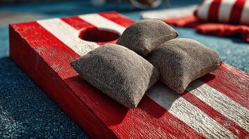 Playing bean bag toss on a sunny day in the park with colorful equipment and fun designs photo