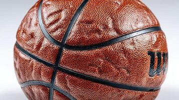 Close-up view of a basketball highlighting its textured surface and design in a studio setting photo